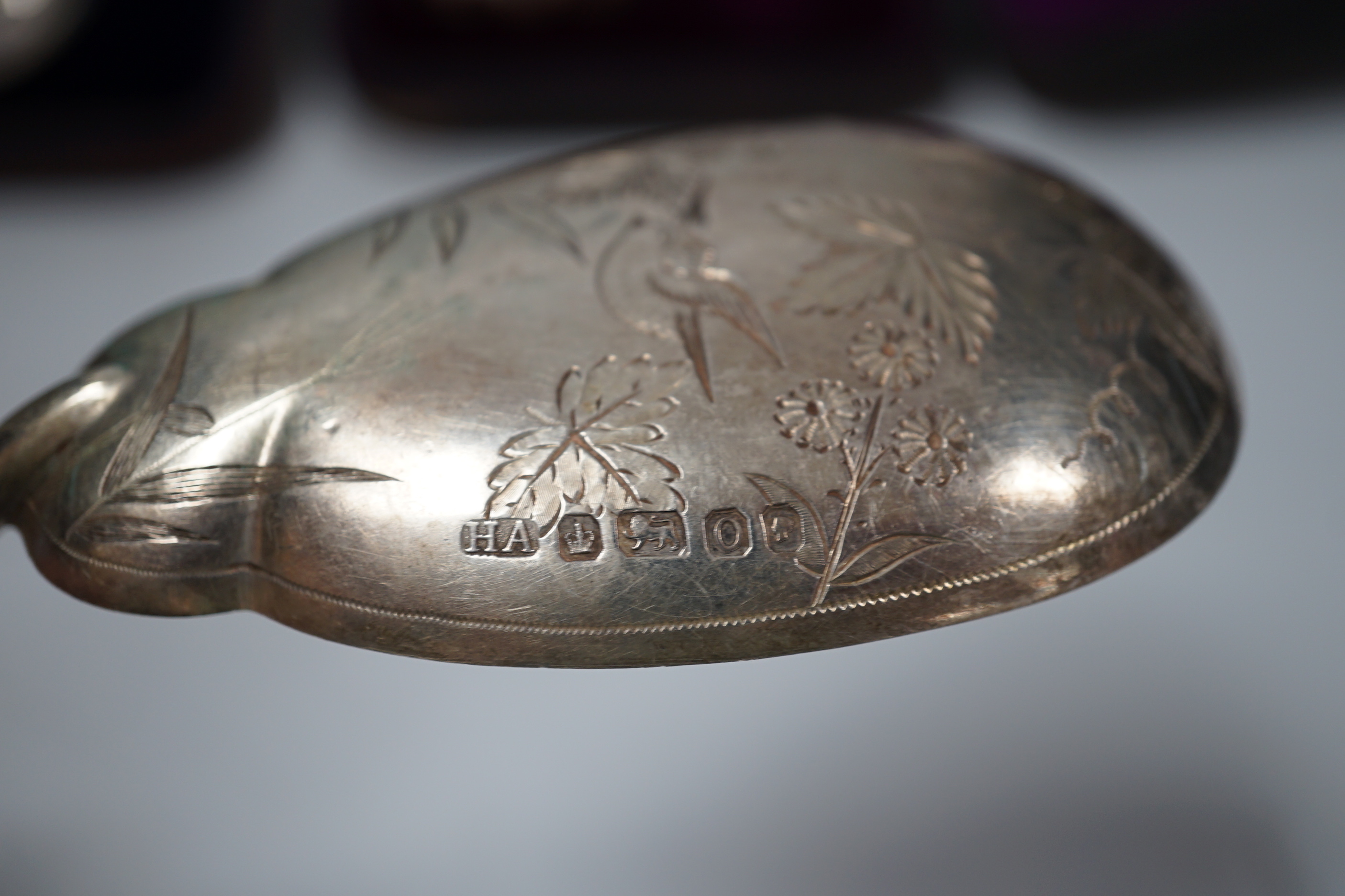 A cased pair of Victorian aesthetic period silver salad servers, Atkin Brothers, Sheffield, 1881 and a cased set of silver teaspoons, sugar spoon and tongs.